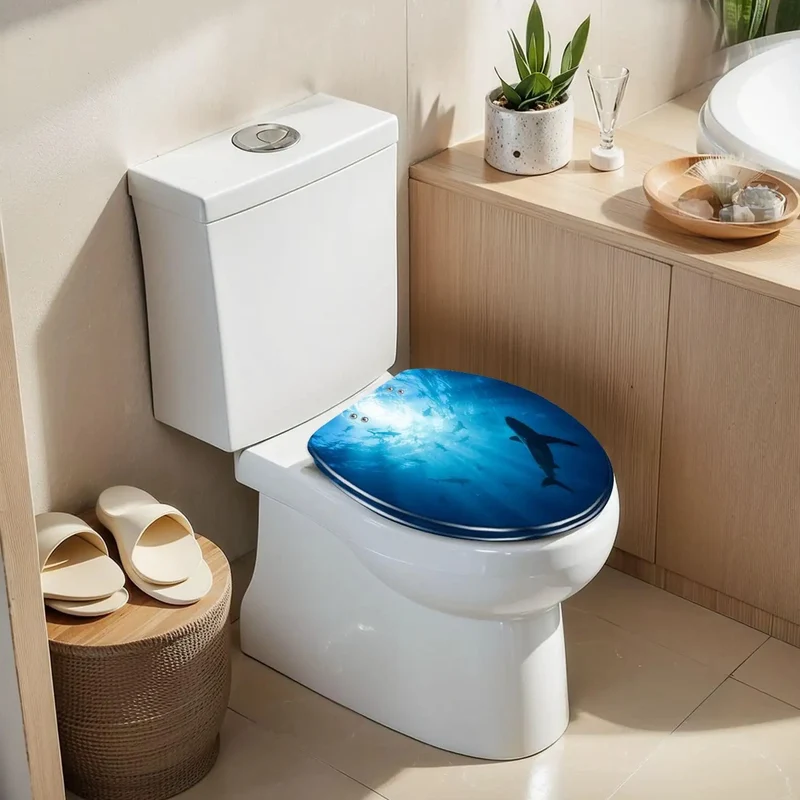 Elongated Toilet Seat Crafted From Tough As Nails Resin With A Smooth Soft Close Lid Displaying A Slick Ocean Shark Design For Your Daily Bathroom Grind And Hassle Free Install