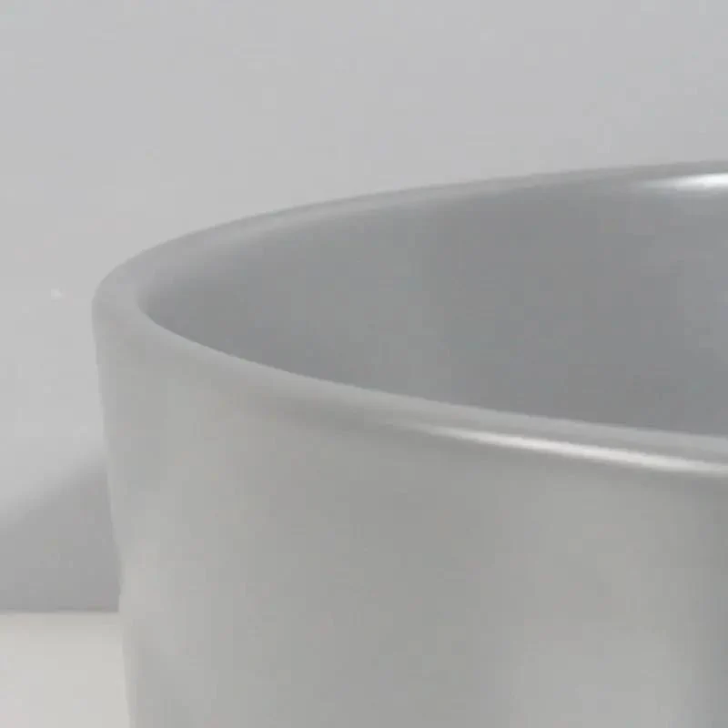 Sleek Round Ceramic Vessel Sink In Matte Gray Finish For A Pretty Sweet Bathroom Glow Up Durable Countertop Basin With Standard Drain Size And Smooth Edge Design
