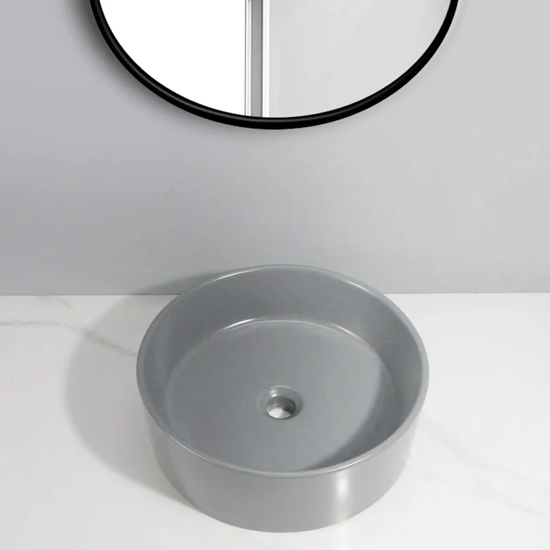 Sleek Round Ceramic Vessel Sink In Matte Gray Finish For A Pretty Sweet Bathroom Glow Up Durable Countertop Basin With Standard Drain Size And Smooth Edge Design