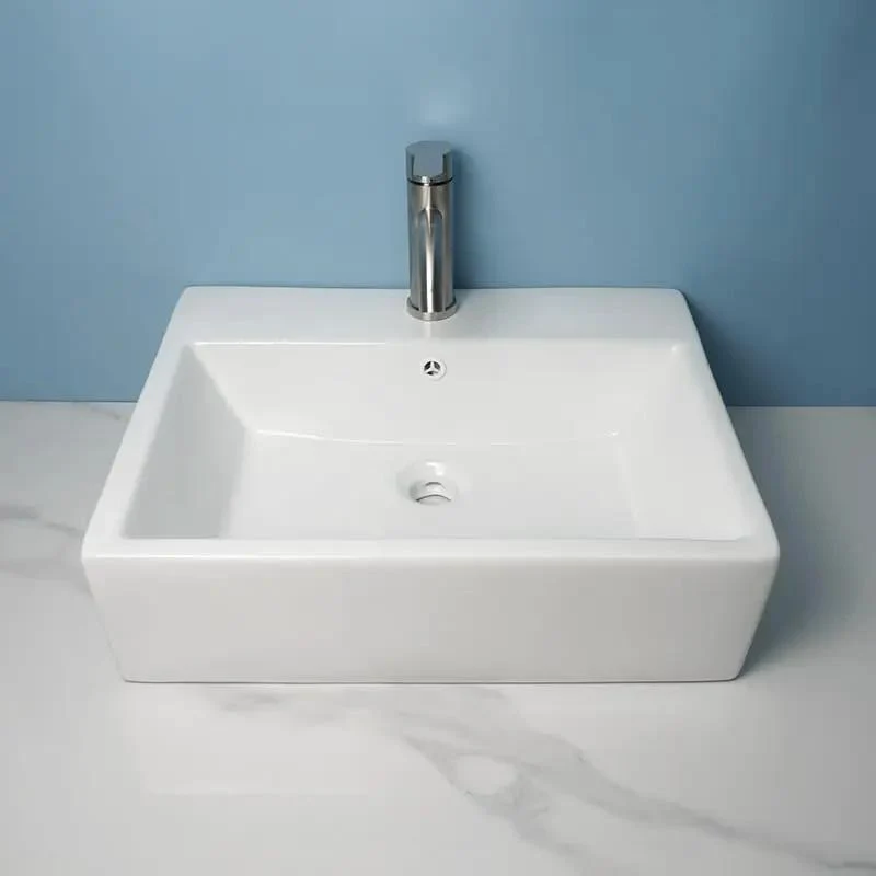 Slick Ceramic Vessel Sink Bathroom Washbasin Above Ground Wall Mount Basin With Sharp Modern Luxury Lines Smooth Glaze Finish Effortless Install Top Shelf Durable Contemporary Fixtures