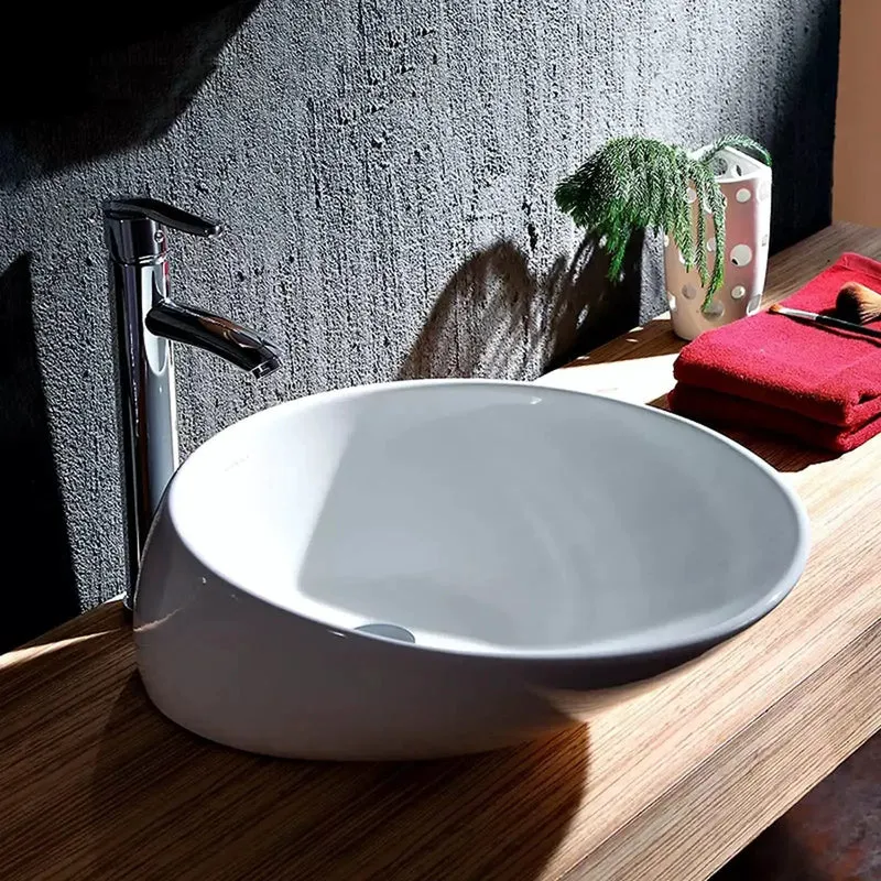 Premium Oval Vessel Sink That Sits Above Counter Using Top Tier White Porcelain Ceramic With A Fresh Marble Texture And Clean No Overflow Design To Give Your Bathroom A Straight Fire Upgrade