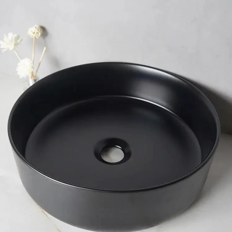 Top Tier Round Ceramic Vessel Sink In Dope Matte Black Finish Above Counter Wash Basin With Hella Strong Build For Modern Bathrooms And Fresh Lounge Areas