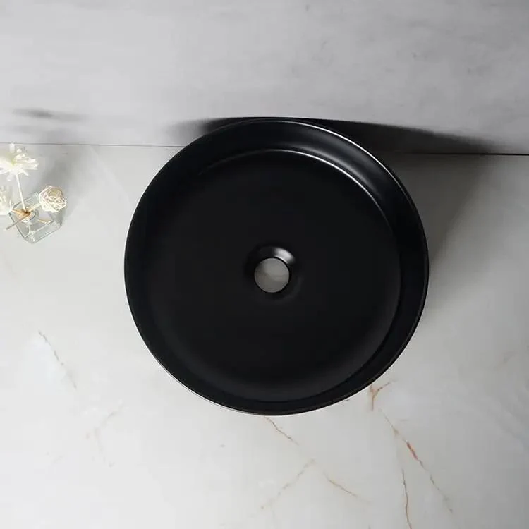 Top Tier Round Ceramic Vessel Sink In Dope Matte Black Finish Above Counter Wash Basin With Hella Strong Build For Modern Bathrooms And Fresh Lounge Areas