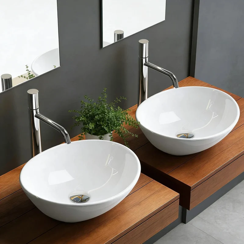 Compact Oval Ceramic Above Counter Sink For Small Bathrooms Boasting A Knockout Washing Bowl Sleek Glazed Finish And No Headache Installation That Slips Into Tight Vanities While Keeping Surfaces Slick And Spotless