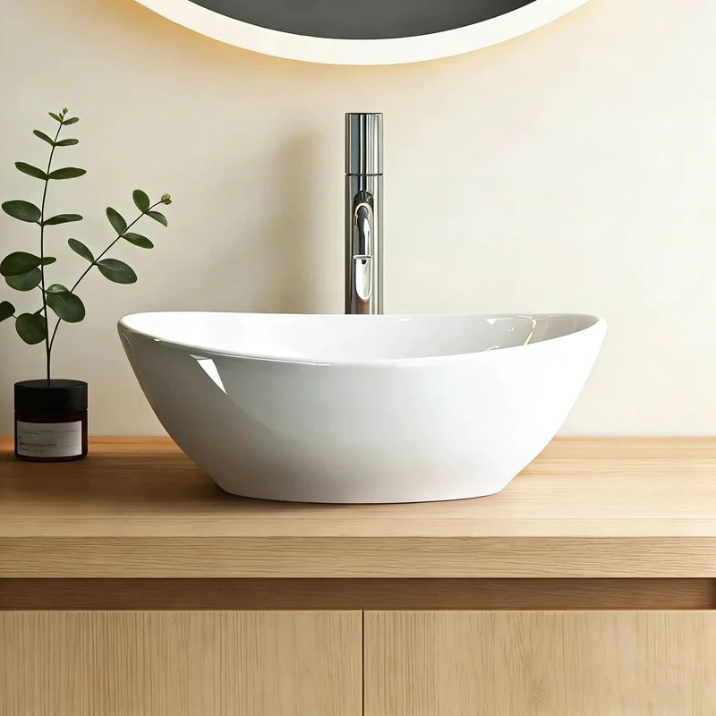 Compact Oval Ceramic Above Counter Sink For Small Bathrooms Boasting A Knockout Washing Bowl Sleek Glazed Finish And No Headache Installation That Slips Into Tight Vanities While Keeping Surfaces Slick And Spotless