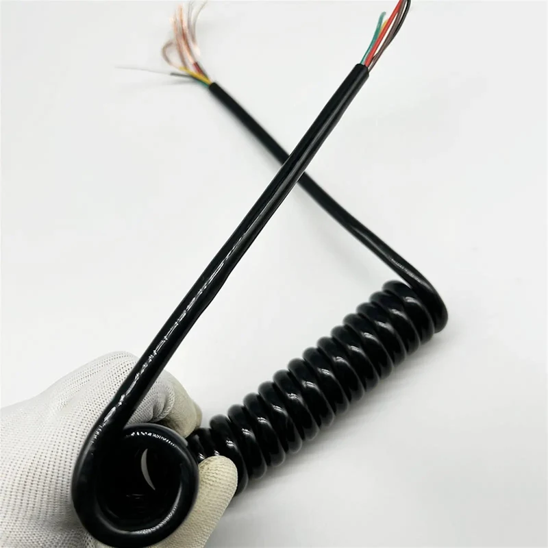 Slick Black Braided Expandable Power Cord With Coiled Spring Design Offers Snappy Auto Retracting Action That Gives You Extra Reach Without The Mess Perfect For Workspaces And Living Spaces
