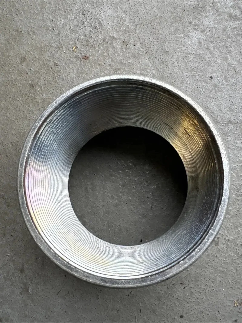Rock Solid Four Inch Galvanized Steel Conduit Coupler For Electrical Raceway Systems Pro Grade Raceway Splice Sleeve Built For No Sweat Wire Run Installations And Dependable Circuit Protection